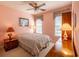 Cozy bedroom with pink walls, two windows, and wooden furniture at 6486 Somersby Dr., Murrells Inlet, SC 29576