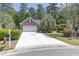 Charming brick home featuring a well-manicured lawn, a spacious driveway, and a two-car garage at 6486 Somersby Dr., Murrells Inlet, SC 29576