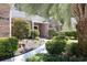 Well-maintained brick home with a welcoming entrance, landscaped garden, and a concrete walkway at 6486 Somersby Dr., Murrells Inlet, SC 29576