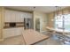 Bright kitchen with stainless steel appliances, island, and a breakfast nook near the window at 6486 Somersby Dr., Murrells Inlet, SC 29576