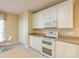 Bright kitchen with white appliances, including a double oven, and generous counter space at 6486 Somersby Dr., Murrells Inlet, SC 29576