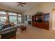 Spacious living room features a fireplace, custom built-ins, and access to the outdoor living space at 6486 Somersby Dr., Murrells Inlet, SC 29576