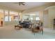Spacious living room featuring plush seating, carpet flooring, and an open floor plan at 6486 Somersby Dr., Murrells Inlet, SC 29576