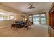 Spacious living room features a fireplace, custom built-ins, and access to the outdoor living space at 6486 Somersby Dr., Murrells Inlet, SC 29576