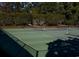 Outdoor tennis courts surrounded by tall trees at 6486 Somersby Dr., Murrells Inlet, SC 29576