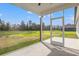 Inviting screened porch offering a serene view of the expansive backyard at 7103 Louisville Rd., Aynor, SC 29511