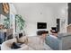Bright and airy living room with a fireplace, a large window, comfortable seating, and stylish decor at 752 Hobonny Loop, Longs, SC 29568