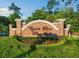 Beautiful brick entrance to Cypress River Plantation, landscaped with colorful flowers at 8008 Mcsweeney Ct., Myrtle Beach, SC 29588