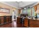 Cozy office space with hardwood floors, built-in cabinets, and natural light from bay windows at 8008 Mcsweeney Ct., Myrtle Beach, SC 29588