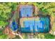 Aerial view of basketball court, tennis court, and playground in a wooded common area at 8008 Mcsweeney Ct., Myrtle Beach, SC 29588
