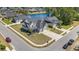 Aerial view of a property featuring a well-manicured lawn, attractive landscaping, and a spacious driveway at 801 Celene Ct., Myrtle Beach, SC 29579