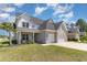 Charming two-story home boasts a brick and stucco exterior, attached garage, and lush green lawn at 801 Celene Ct., Myrtle Beach, SC 29579