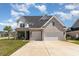 Stunning two-story home featuring a brick facade, attached two-car garage, and a well-manicured lawn at 801 Celene Ct., Myrtle Beach, SC 29579