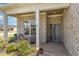 Inviting front porch with seating, brick accents, and a well-maintained garden showcasing curb appeal at 801 Celene Ct., Myrtle Beach, SC 29579