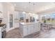 Bright kitchen with white cabinets, large center island, stainless steel appliances, and eat-in area at 801 Celene Ct., Myrtle Beach, SC 29579