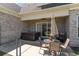 Outdoor patio features a hot tub, table with seating, and a grill, perfect for relaxation at 801 Celene Ct., Myrtle Beach, SC 29579