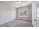 A bright and spacious bedroom featuring neutral carpet and a large window at 108 Old Chimney Ln, Conway, SC 29526