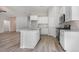 Open kitchen with granite countertops, stainless steel appliances and gray wood flooring at 108 Old Chimney Ln, Conway, SC 29526