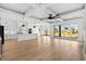 Bright open floorplan with a large island, modern kitchen, and sliding doors leading to a patio at 1219 Bentcreek Ln., Myrtle Beach, SC 29579