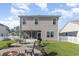 Charming backyard featuring a brick fire pit, outdoor seating, and a screened in porch at 1313 Cascarilla Ct., Myrtle Beach, SC 29579