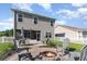 The backyard has a fire pit, outdoor seating, and a screened in porch, perfect for entertaining at 1313 Cascarilla Ct., Myrtle Beach, SC 29579