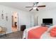 Relaxing bedroom with a ceiling fan, soft textures, and an inviting ensuite bathroom at 1313 Cascarilla Ct., Myrtle Beach, SC 29579