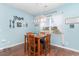 Charming dining area featuring wood table, modern lighting, and inspirational wall décor with lots of natural light at 1313 Cascarilla Ct., Myrtle Beach, SC 29579