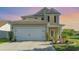 Charming two-story home featuring a two-car garage, manicured lawn, and beautiful landscaping at 1313 Cascarilla Ct., Myrtle Beach, SC 29579