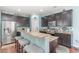 Well-appointed kitchen featuring granite countertops, stainless steel appliances, and a convenient breakfast bar at 1313 Cascarilla Ct., Myrtle Beach, SC 29579