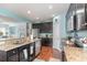 Spacious kitchen with stainless steel appliances, granite countertops, and a seamless flow to the living area at 1313 Cascarilla Ct., Myrtle Beach, SC 29579