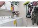 Functional laundry room featuring ample storage space, washer, dryer, and convenient hanging racks at 1313 Cascarilla Ct., Myrtle Beach, SC 29579