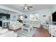 Open-concept living room with stylish furnishings and lots of natural light at 1313 Cascarilla Ct., Myrtle Beach, SC 29579
