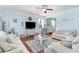 Spacious living room with hardwood floors, comfortable seating, and an open layout to the dining area at 1313 Cascarilla Ct., Myrtle Beach, SC 29579