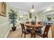 Dining room featuring a wood table and chairs with a view to the kitchen and living area at 1352 Villa Marbella Ct. # 1-204, Myrtle Beach, SC 29572