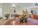 Dining table with flower centerpiece with a view to the living room and bar at 1352 Villa Marbella Ct. # 1-204, Myrtle Beach, SC 29572
