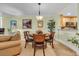Dining area with wood table, upholstered chairs and decorative hanging lighting at 1352 Villa Marbella Ct. # 1-204, Myrtle Beach, SC 29572