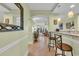 Hallway view of a breakfast bar with seating and tile flooring at 1352 Villa Marbella Ct. # 1-204, Myrtle Beach, SC 29572