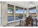 Enclosed lanai with picturesque water views, a ceiling fan, and a comfortable seating area for relaxation at 1352 Villa Marbella Ct. # 1-204, Myrtle Beach, SC 29572