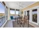 Charming lanai featuring serene water views, a ceiling fan, and cozy outdoor seating for enjoying the scenery at 1352 Villa Marbella Ct. # 1-204, Myrtle Beach, SC 29572