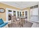 Inviting outdoor space with a ceiling fan, comfortable seating, and views of the surrounding neighborhood at 1352 Villa Marbella Ct. # 1-204, Myrtle Beach, SC 29572
