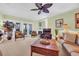 Inviting living room with a cozy fireplace and access to a balcony with serene outdoor views at 1352 Villa Marbella Ct. # 1-204, Myrtle Beach, SC 29572