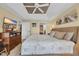 Well-lit main bedroom with an ornate ceiling, an entertainment center, and access to the ensuite bathroom at 1352 Villa Marbella Ct. # 1-204, Myrtle Beach, SC 29572