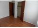 Bedroom featuring wood-look floors, closet, and a neutral color palette at 1465 Dirty Branch Rd., Conway, SC 29527