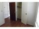 Bedroom with wood-look floors and closet with two doors open at 1465 Dirty Branch Rd., Conway, SC 29527
