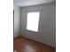 A light-filled bedroom with wood-look flooring, a window, and neutral walls at 1465 Dirty Branch Rd., Conway, SC 29527