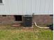 Outdoor view of a Goodman air conditioning unit and brick foundation at 1465 Dirty Branch Rd., Conway, SC 29527