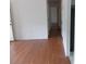 Clean hallway with hardwood floors, providing access to various rooms within the home at 1465 Dirty Branch Rd., Conway, SC 29527