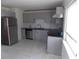Updated kitchen with stainless steel appliances, gray cabinetry, and modern finishes at 1465 Dirty Branch Rd., Conway, SC 29527