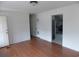 Bright living room with hardwood floors and fresh paint, showcasing the home's move-in readiness at 1465 Dirty Branch Rd., Conway, SC 29527