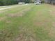 Large flat yard with some trees, home and a manufactured home visible at 1465 Dirty Branch Rd., Conway, SC 29527